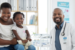 Doctor and patients sitting together in Dr's office smiling