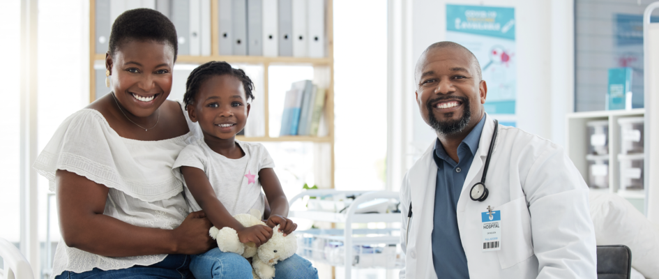 Doctor and patients sitting together in Dr's office smiling