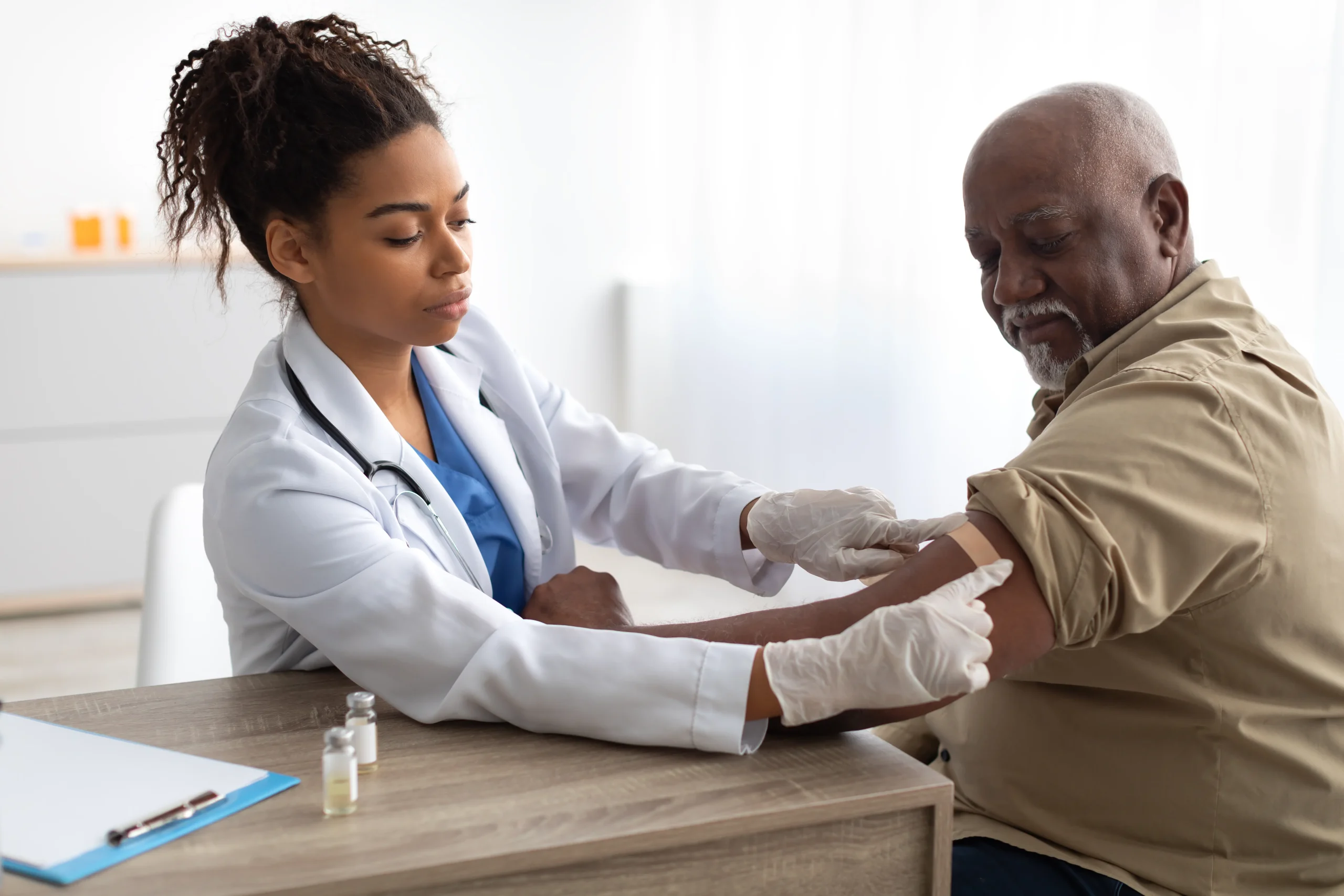 Elder man getting tests done by doctor