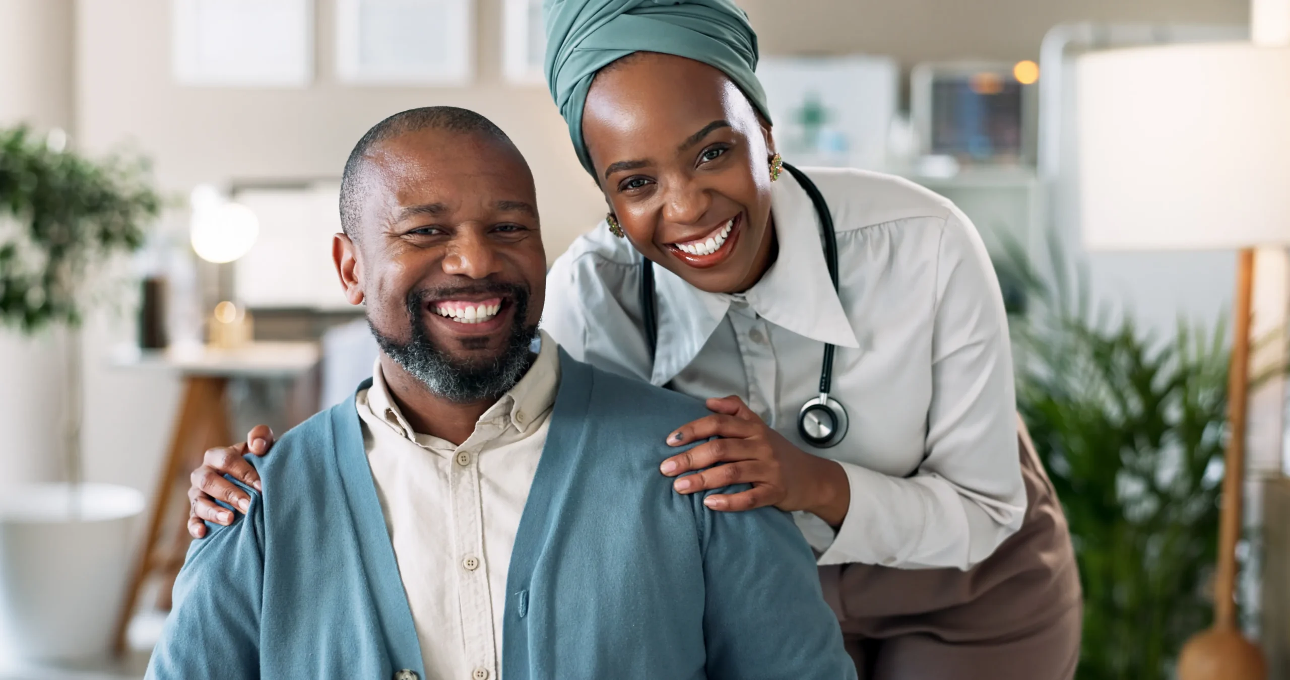Male patient and doctor standing together for a photo