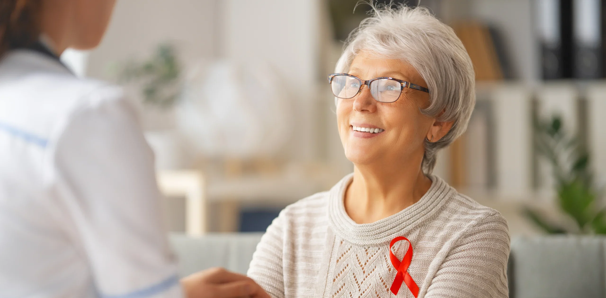 Elderly woman listening to doctor during consultation