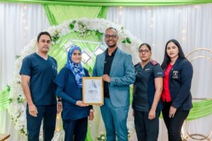 Shifa Private Hospital staff standing with WSO award