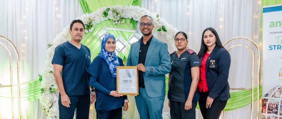 Shifa Private Hospital staff standing with WSO award