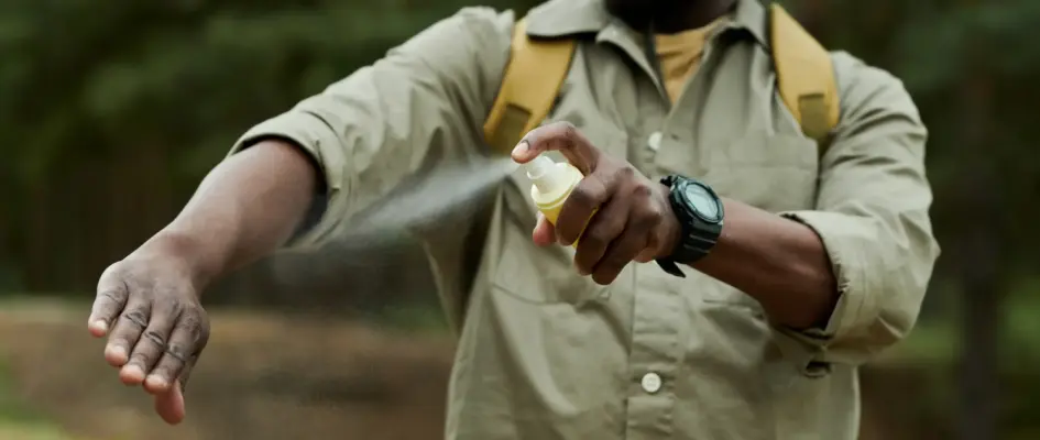 man-using-mosquito-spray-outdoors-2026-01-08-00-24-18-utc (1)_compressed man using mosquito spray outdoors. Malaria