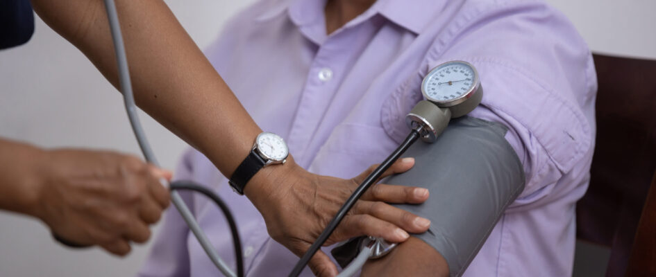 blood pressure being checked by health care provider