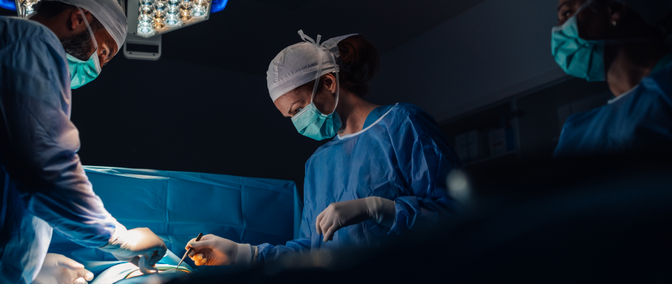 Surgeon dressed in surgical clothing during a procedure