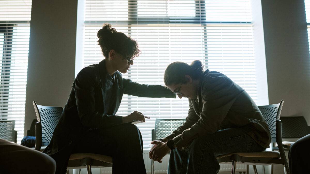 compassionate-woman-supporting-distressed-person