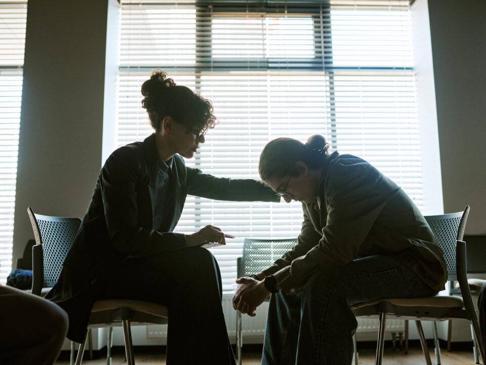 compassionate-woman-supporting-distressed-person