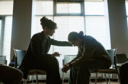 compassionate-woman-supporting-distressed-person