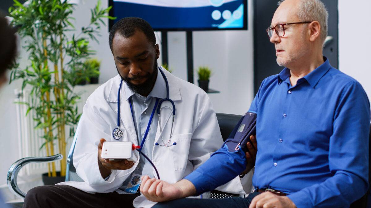 doctor-checks-senior-patient-s-blood-pressure