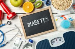 Word Diabetes and diabetic accessories on wooden background Word Diabetes and diabetic accessories on wooden background