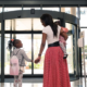 mother and two children walking out of the hospital