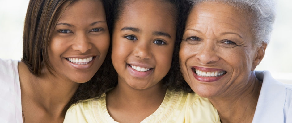 mother, daughter and granddaughter smiling