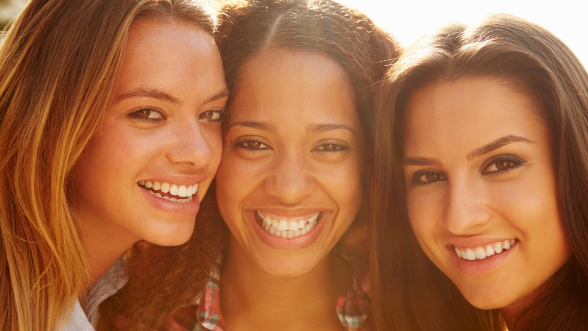 portrait of three women smiling