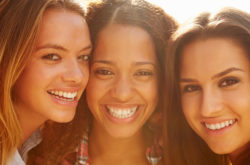 portrait of three women smiling