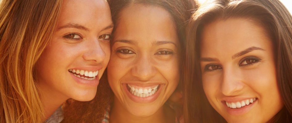 portrait of three women smiling