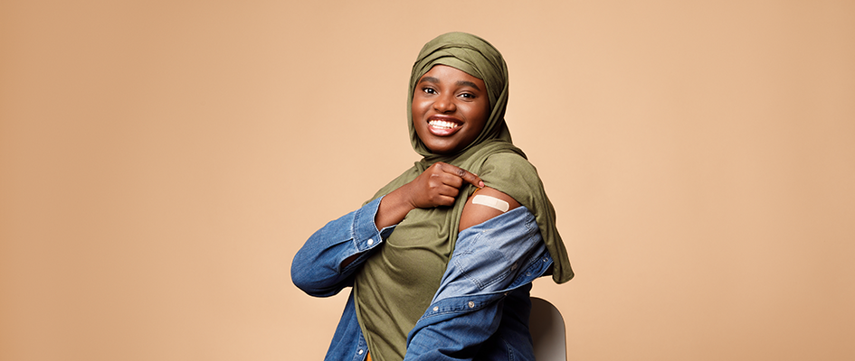 Woman Showing Vaccinated Arm With Bandage After Injection, orange Background