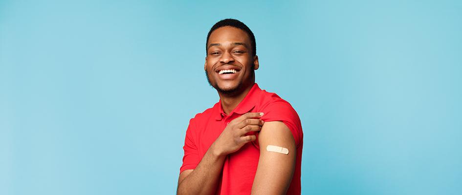 Vaccinated Black Man Showing Arm