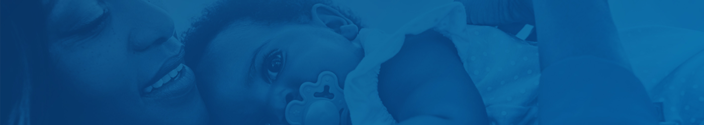 mother and baby lying down with blue filter on