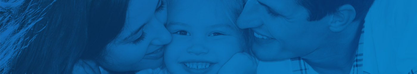 parents kissing their child with blue filter