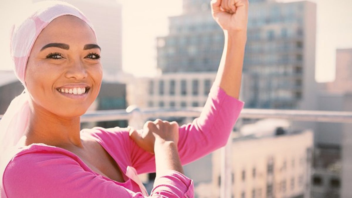 muslim woman holding her left bicep