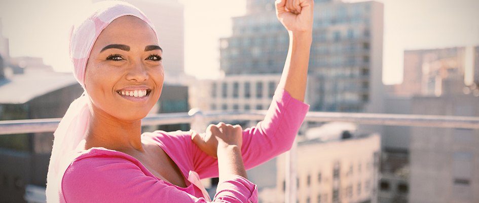 muslim woman holding her left bicep