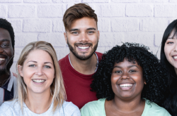 group of women and men smiling