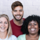 group of women and men smiling