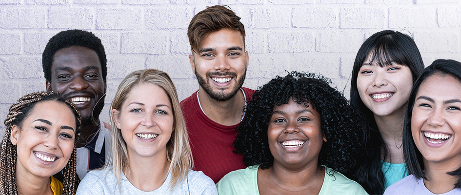 group of women and men smiling