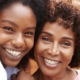 mother and daughter smiling