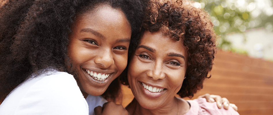 mother and daughter smiling