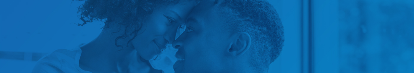 Couple smiling with heads against each other