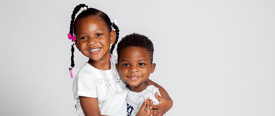 kids hugging and smiling