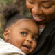 Happy African American mother and her daughter.