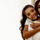 smiling woman piggybacking her daughter