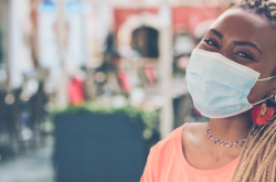 woman smiling with mask on