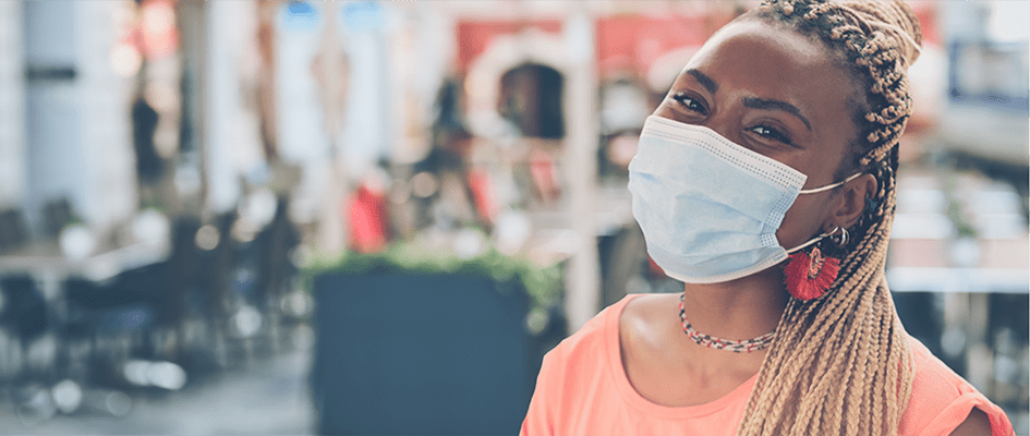 woman smiling with mask on