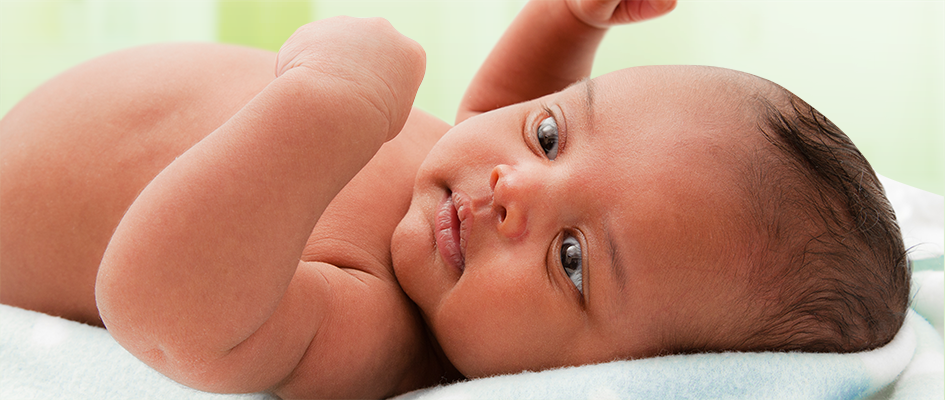 cute baby lying on his back