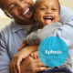aphasia brochure cover with father and son laughing as a background