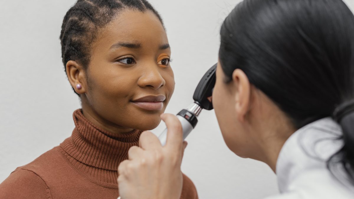 close up doctor checking patient eye