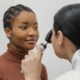 close up doctor checking patient eye