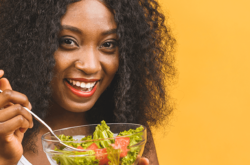 woman eating from a salad bowl