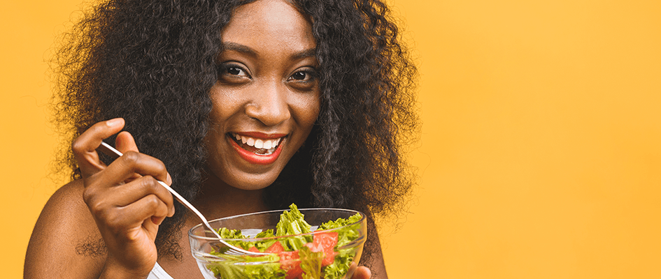 woman eating from a salad bowl
