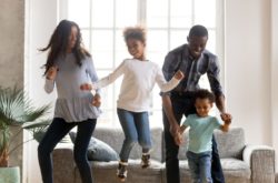 African family dancing in their living room