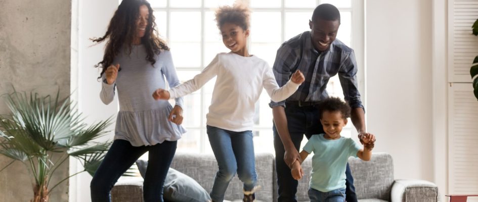 African family dancing in their living room