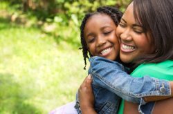 Mother and daughter happily hugging