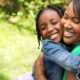 Mother and daughter happily hugging