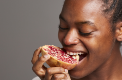 woman eating pomegranate