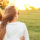 couple hugging and watching sunset