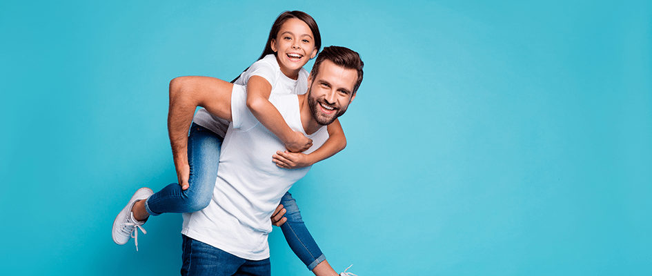 Dad playing with daughter on her back